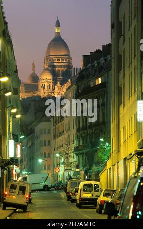 THE SACRE-COEUR SEEN FROM THE CHARTRES STREET, PARIS 18EME (75). Stock Photo