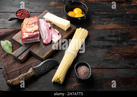 Ingredients for making traditional italian spaghetti carbonara set, on old dark wooden table, with copy space for text Stock Photo