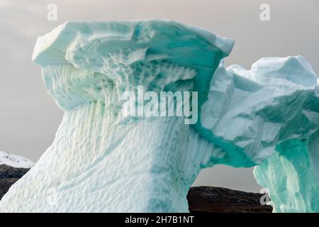 Convoluted iceberg in shades of blue, Rypefjord, Scoresby Sund, East Greenland Stock Photo