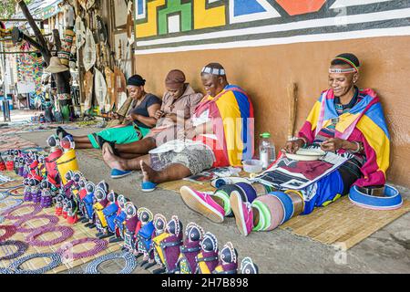 Johannesburg South Africa,Lesedi African Lodge & Cultural Village,Zulu Xhosa Pedi Basotho Ndebele tribes Black women female,arts & crafts selling Stock Photo