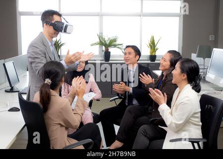 Young businessman is developer design testing of connection metaverse on vr realistic in the office, development global of engineer for creative appli Stock Photo