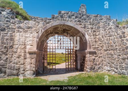 Entrance gates to the ruins of the fortress and the ancient settlement - Lori Berd. Travel and historical destinations in Armenia Stock Photo