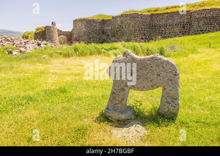 Entrance gates and old statue of the ruins of the fortress and the ancient settlement - Lori Berd. Travel and historical destinations in Armenia Stock Photo