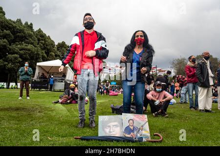 Concert goers enjoy, dance and chant to salsa cocke, salsa, cumbia and jazz during the second day of the 'IDARTES 10 AÑOS' musical festival that carries rock, metal, punk, salsa and hip hop music across two weekends (20-21 and 27-28 of November) at the Simon Bolivar Park and Scenario 'La Media Torta' in Bogota, Colombia on November 21, 2021. Stock Photo