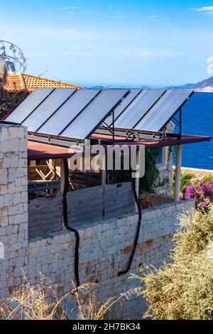 Solar panels on the roof. Generating cheap electricity from solar energy. Stock Photo