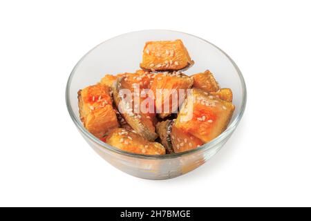 Baked pumpkin slices sprinkled with sesame seeds in a glass cup Stock Photo