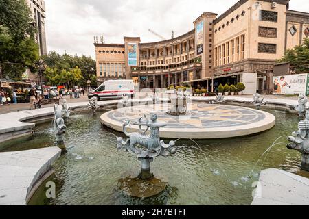 25 May 2021, Yerevan, Armenia: Famous fountain at Charles Aznavour square near Moscow Cinema Stock Photo