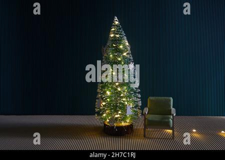 Christmas concept interior room , christmas tree, chair, in empty room interior with green wall. Stock Photo