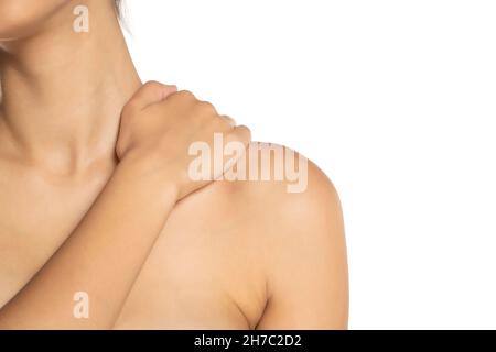 woman holding her painful neck on white background Stock Photo