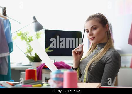 Blonde woman having wonderful idea in her head and wants to realize it Stock Photo