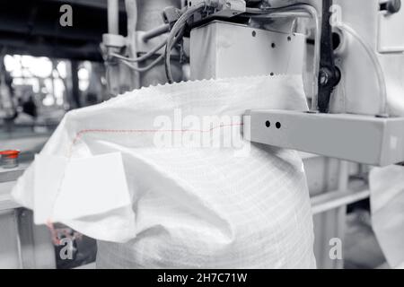 Automatic bag stapler with thread, product packaging for transportation. Stock Photo