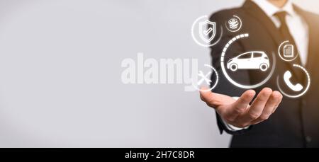 Digital composite of Man holding car icon.Car automobile insurance and car services concept. Businessman with offering gesture and icon of car. Stock Photo