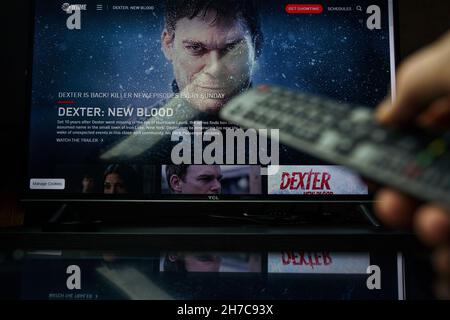 Dexter Tv series and TV controller. Dexter: New Blood is an American crime drama mystery miniseries developed for Showtime as a continuation of the se Stock Photo