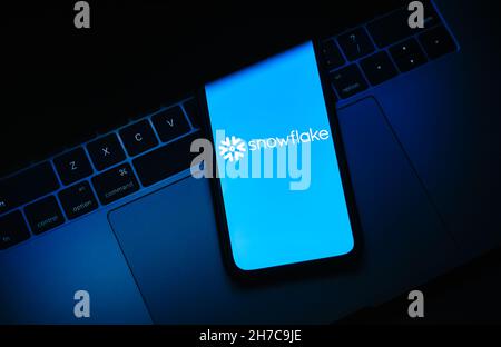 Snowflake logo on smartphone screen. Stock Photo