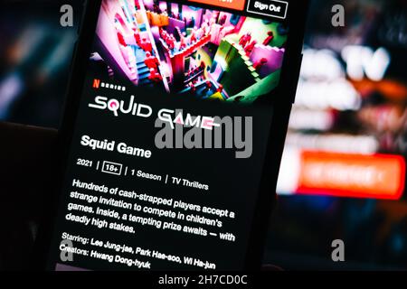 Squid Game tv series logo from Netflix on iPhone. Stock Photo