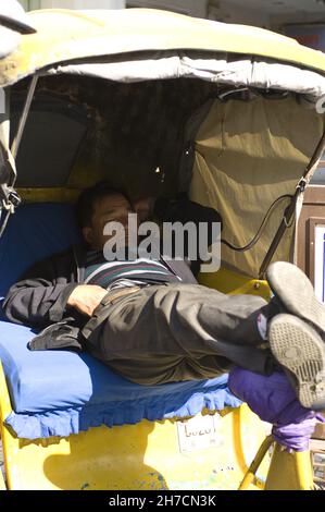 Rickshaw driver sleeping, China, Suzhou Stock Photo