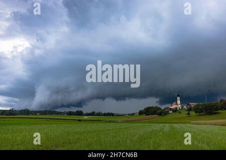 approaching thunderstorm over Bavarian cultural landscape, Germany, Bavaria, Voralpenland, Hoeselwang Stock Photo