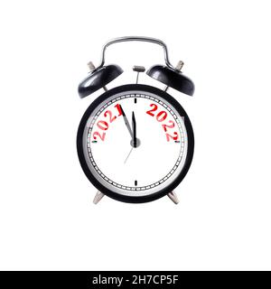 black alarm clock with numerals 2021 and 2022 on white dial,  against white background isolated.New Years coming concept Stock Photo