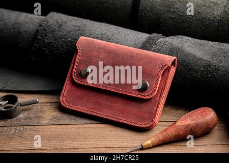 Side view on hand crafted red leather wallet Stock Photo