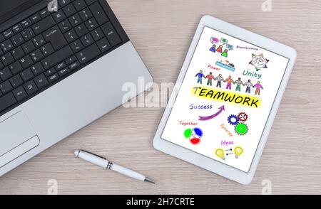 Teamwork concept shown on a digital tablet Stock Photo