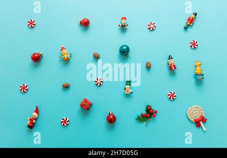 Christmas minimal flat lay. Xmas decoration, baubles and ornaments variety on blue color background, top view. New year, Winter holidays celebration Stock Photo