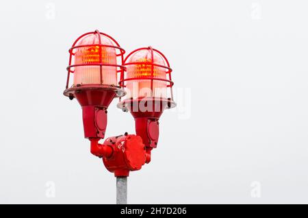 Red warning lights of the lamp, warning at the edges of high buildings objects Stock Photo