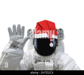 Astronaut in red santa hat raise hand as greeting. Isolated on white background. Elements of this image furnished by NASA Stock Photo