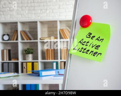 Sticker with words Be an active listener on the board. Stock Photo