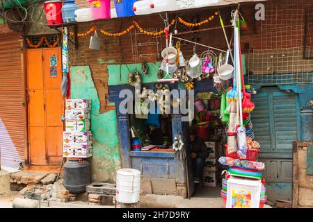 Kathmandu, Nepal - November 17, 2018: Man working in a small shop in central Kathmandu street Stock Photo