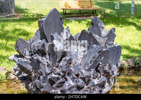 Black stone obsidian or volcanic glass. It was used by shamans of the Aztec tribe for sacrifices and rituals Stock Photo