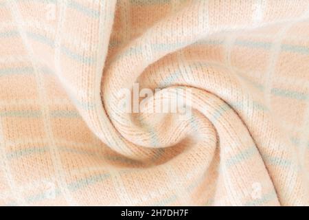 Spiral surface and texture of warm woolen fabric sample close-up Stock Photo