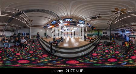 360 degree panoramic view of Friends playing bowling in a colorful bowling bar