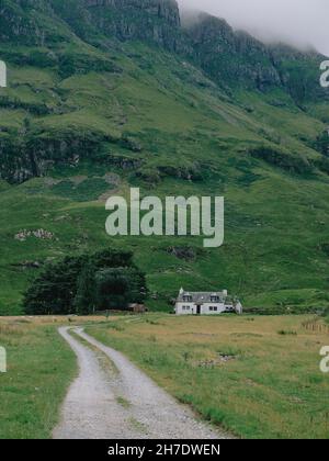 A lone typical white croft in the remote Highland landscape of Glencoe west Highlands Scotland UK - Scotland croft architecture Stock Photo