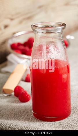 Homemade raspberry liqueur with vodka and raspberry spirit Stock Photo
