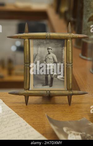 Photo frame made of rifle cartridges collected on the battlefield during the First World War on display in the Armistice Museum in the Forest of Compiègne (Forêt de Compiègne) near Compiègne in France. Front soldiers spent most of their time waiting, many of them kept themselves busy crafting objects so-called trench-handcrafts. These were a wide variety of objects made from the rubble collected on the battlefield. The Armistice Museum is located on the ground of the Glade of the Armistice where the Armistice of 11 November 1918 that ended the First World War was signed. Stock Photo