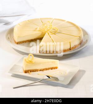 Lemon cheesecake with a biscuit base serves fourteen