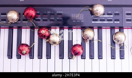 Piano keys with Christmas decorations, closeup Stock Photo