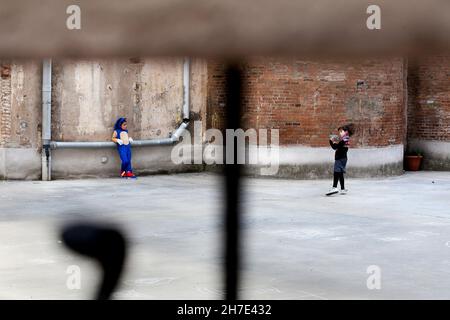 Two children in a playground at a birthday party, Barcelona, Spain. Stock Photo