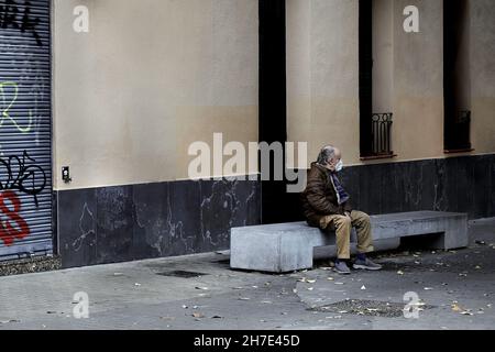 Old man sat on concrete bench, Barcelona, Spain. Stock Photo