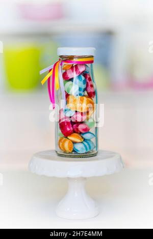 Colourful sweets in a small glass bottle Stock Photo