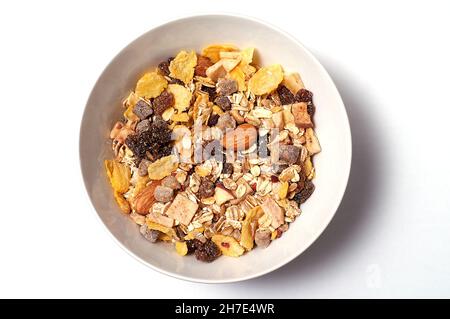 Mixture of oat flakes with various fruit varieties for breakfast Stock Photo