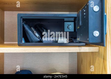 Close up view of open safety deposit box at hotel room. Greece. Stock Photo