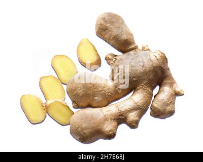 Fresh ginger with sliced pieces isolated on a white background Stock Photo