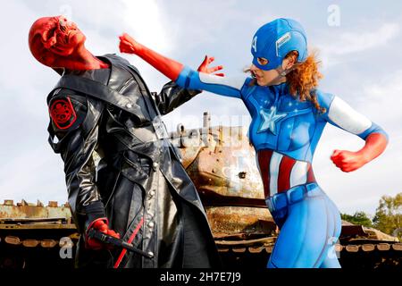 From the Colored Bodies Calendar 2022 - Geek Art-Bodypainting and Transformaking: Captain America vs. Red Skull photoshooting with Lena and Patrick on a military training area in Langenhagen. A project by the photographer Tschiponnique Skupin and the bodypainter Enrico Lein.