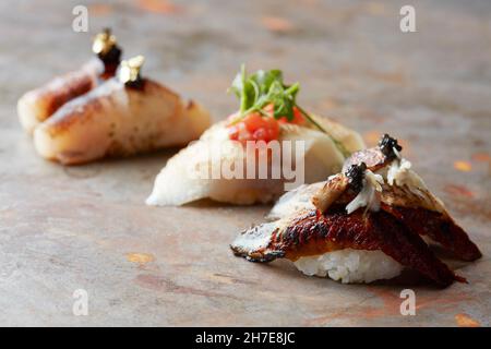 Closeup of fresh sushi on rustic wooden table Stock Photo