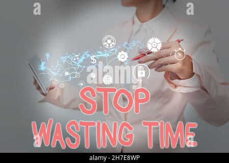 Writing displaying text Stop Wasting Time. Word Written on advising person or group start planning and use it wisely Lady In Suit Holding Phone And Stock Photo