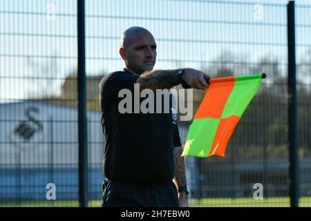 Swansea, Wales. 22 November, 2021. Assistant Referee Liam Beames during the Professional Development League game between Swansea City Under 23s and Charlton Athletic Under 23s at the Swansea City Academy in Swansea, Wales, UK on 22, November 2021. Credit: Duncan Thomas/Majestic Media. Credit: Majestic Media Ltd/Alamy Live News Stock Photo