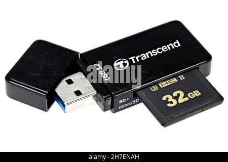 Transcend USB 3.0 SD card reader with inserted 32 GB card isolated on white background Stock Photo