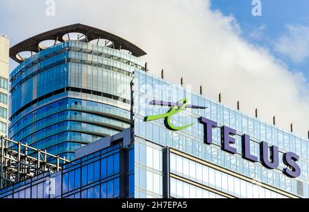 Logo or sign of the Telus Company on the glass facade of a modern building in the downtown district. Nov. 22, 2021 Stock Photo