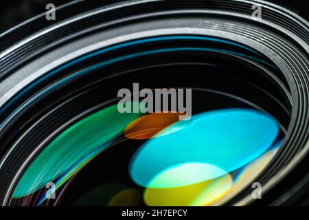 Camera lens with beautiful optical highlights. Macro photography, full frame. Camera Lens background Stock Photo
